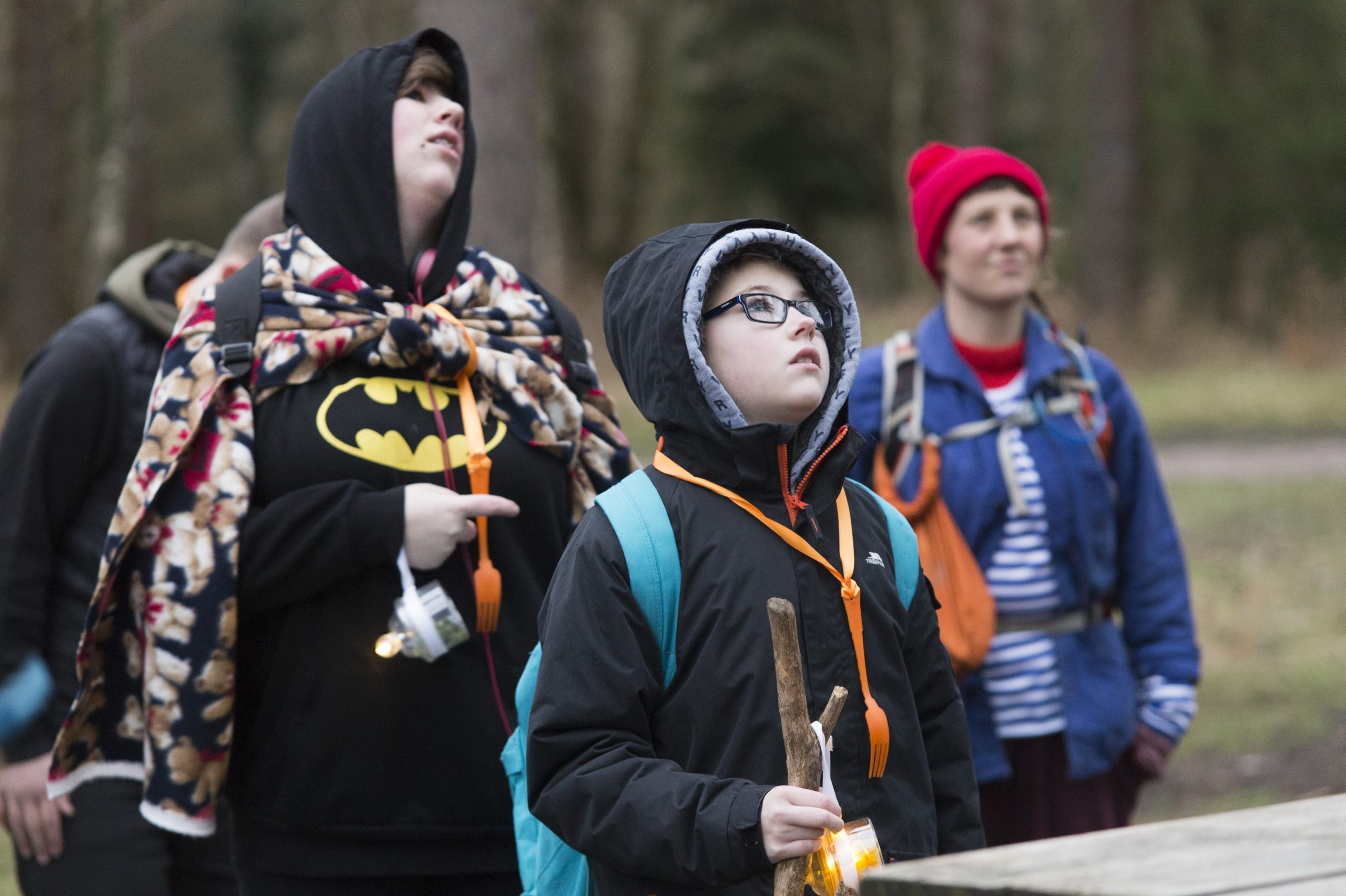 Young audience members, wearing orange forks, hung around their neck from orange ribbons.